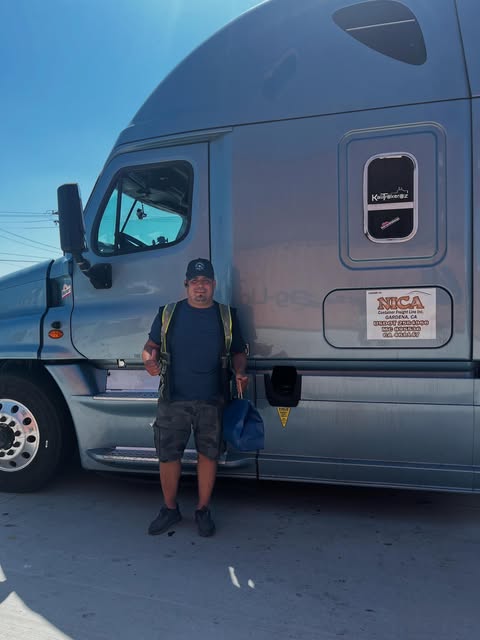 Team beside container