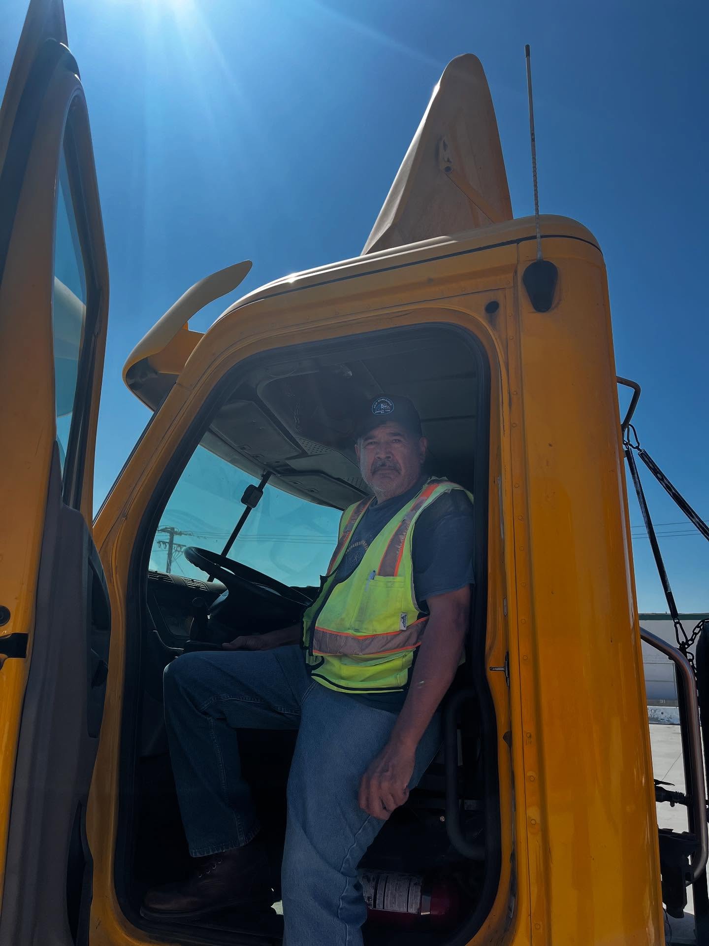 Team beside container