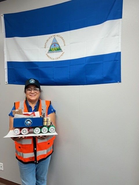 Team beside container